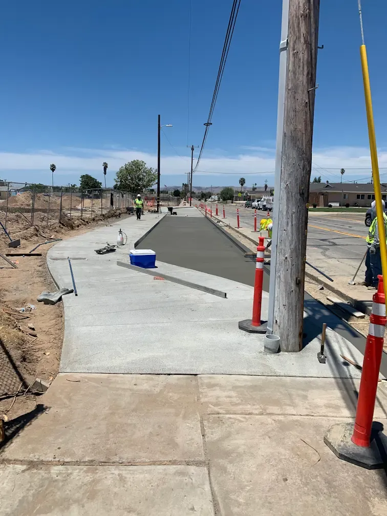 Public works concrete construction including sidewalks, curbs, and municipal infrastructure